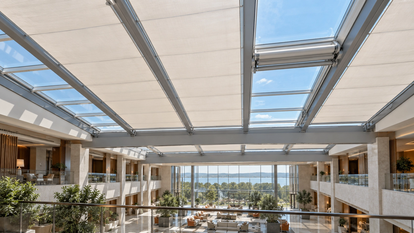 Motorized skylight shading systems installed across a large commercial glass roof